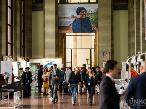 Participants at the first Global Refugee Forum walk through the Salle des Pas Perdus in the Palais des Nations.