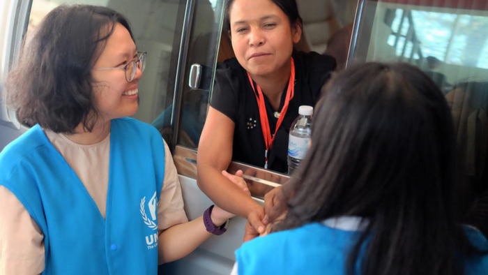 Play the video: A Day in the Life of an International UN Volunteer Working for UNHCR