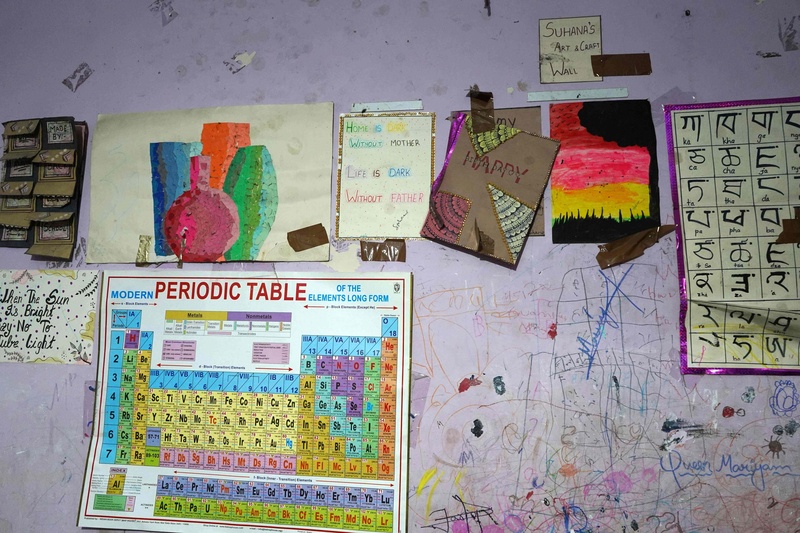 Paintings drawn by Amina  Begum&rsquo;s daughter on the walls of their home depict memories of displacement, fear and hope from their refugee journey.