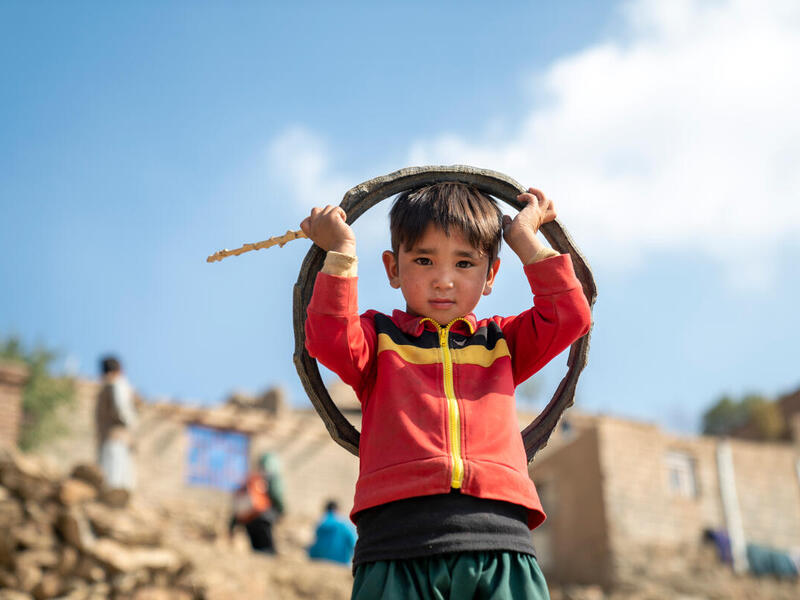 Mustafa, 6, and his brother Zaman are being supported by their mother Fatima, an internally displaced widow from Daikundi Province, in Shahrak Etafaq township, on the outskirts of Kabul, Afghanistan. 