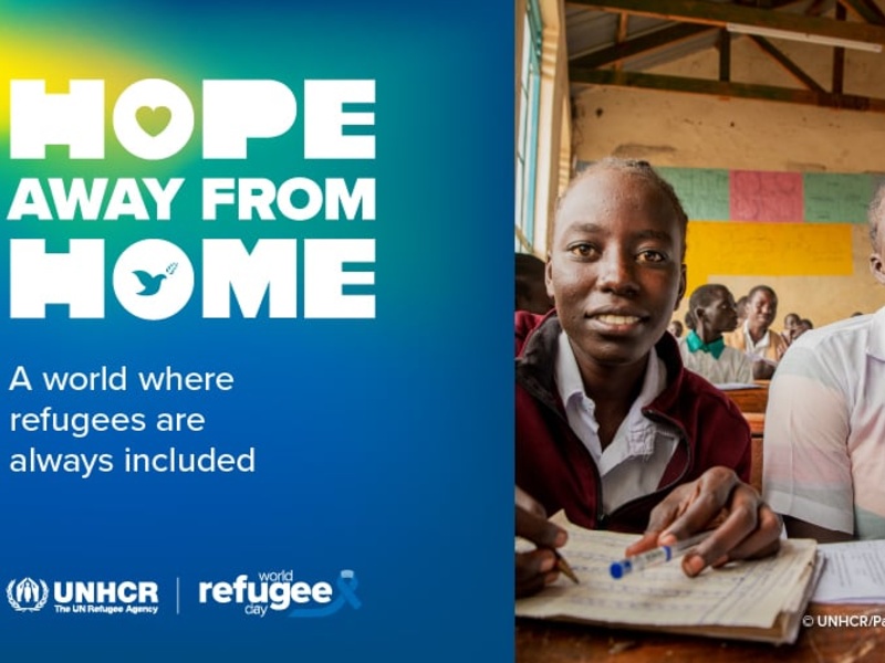 Two girls sitting at a desk in a classroom. On the left, a text reads "Hope away from home".