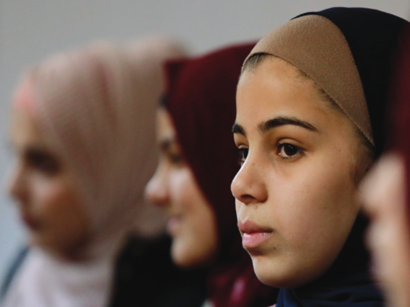 Four women standing side to side