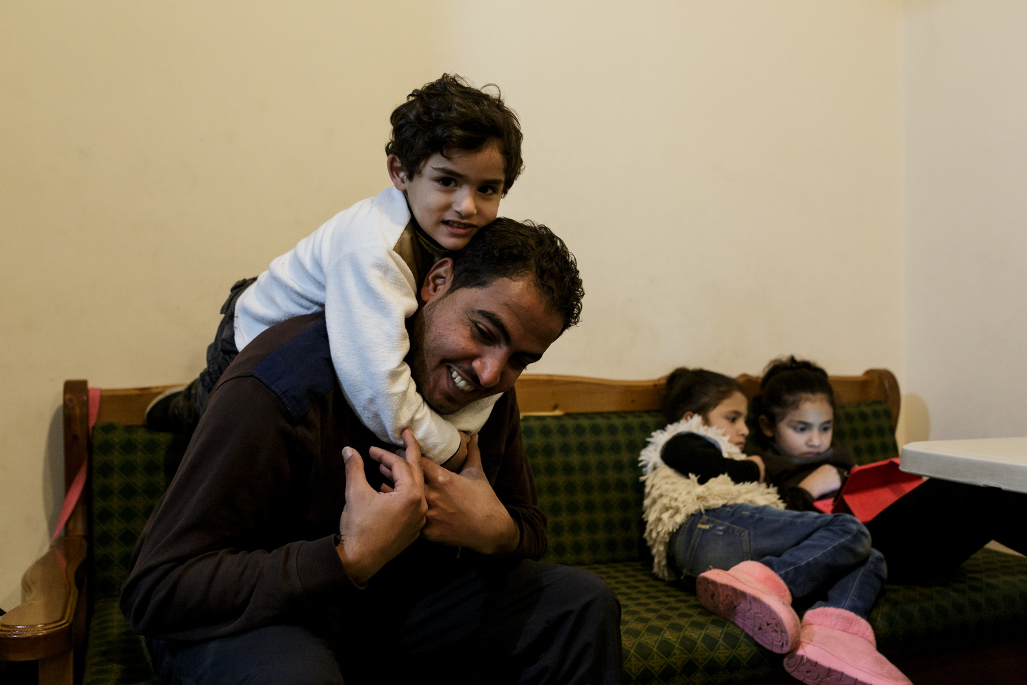 Greece. The Syrian electrician installing power at Lesbos refugee camp