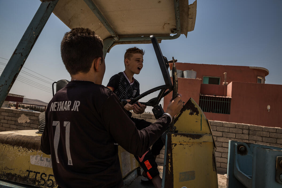 Iraq. Yazidi child gets ready to reunite with his mother in Canada