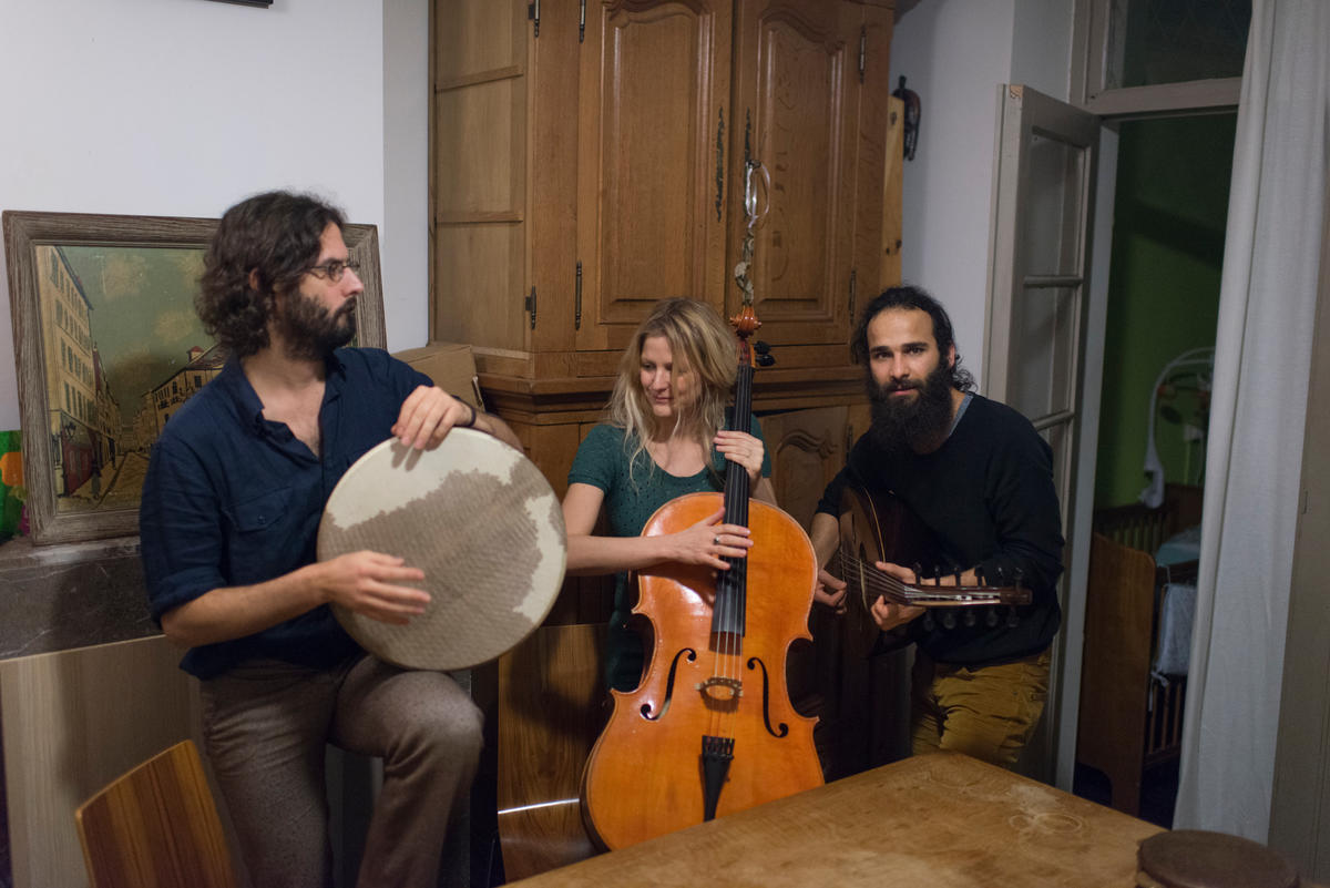 Belgium. An iraki refugee playing lute.