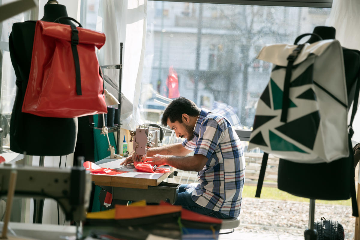 Germany. A non-profit initiative is employing newcomers to upcycle broken refugee boats into thought-provoking products.