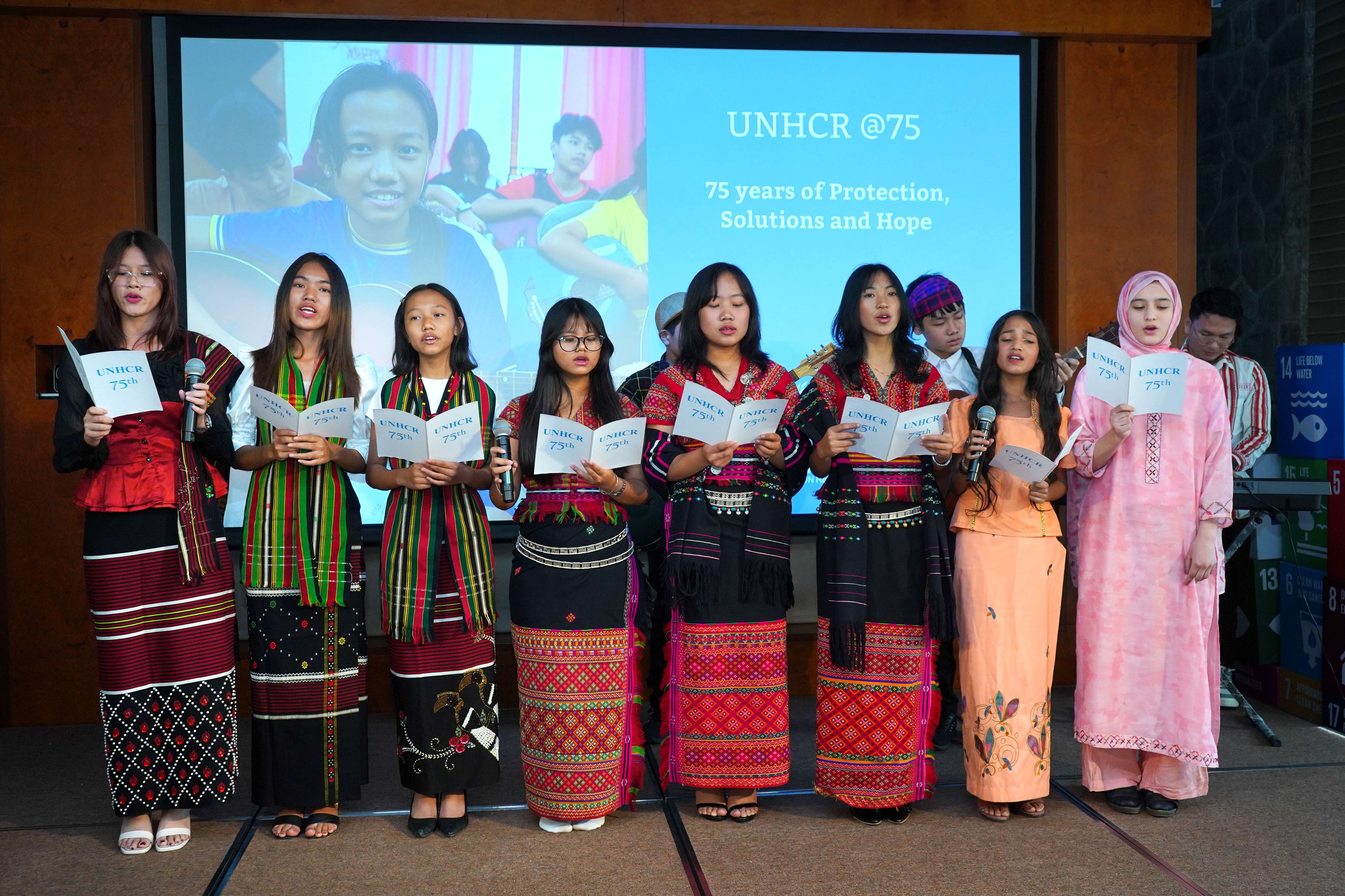 Refugee youth performing traditional song