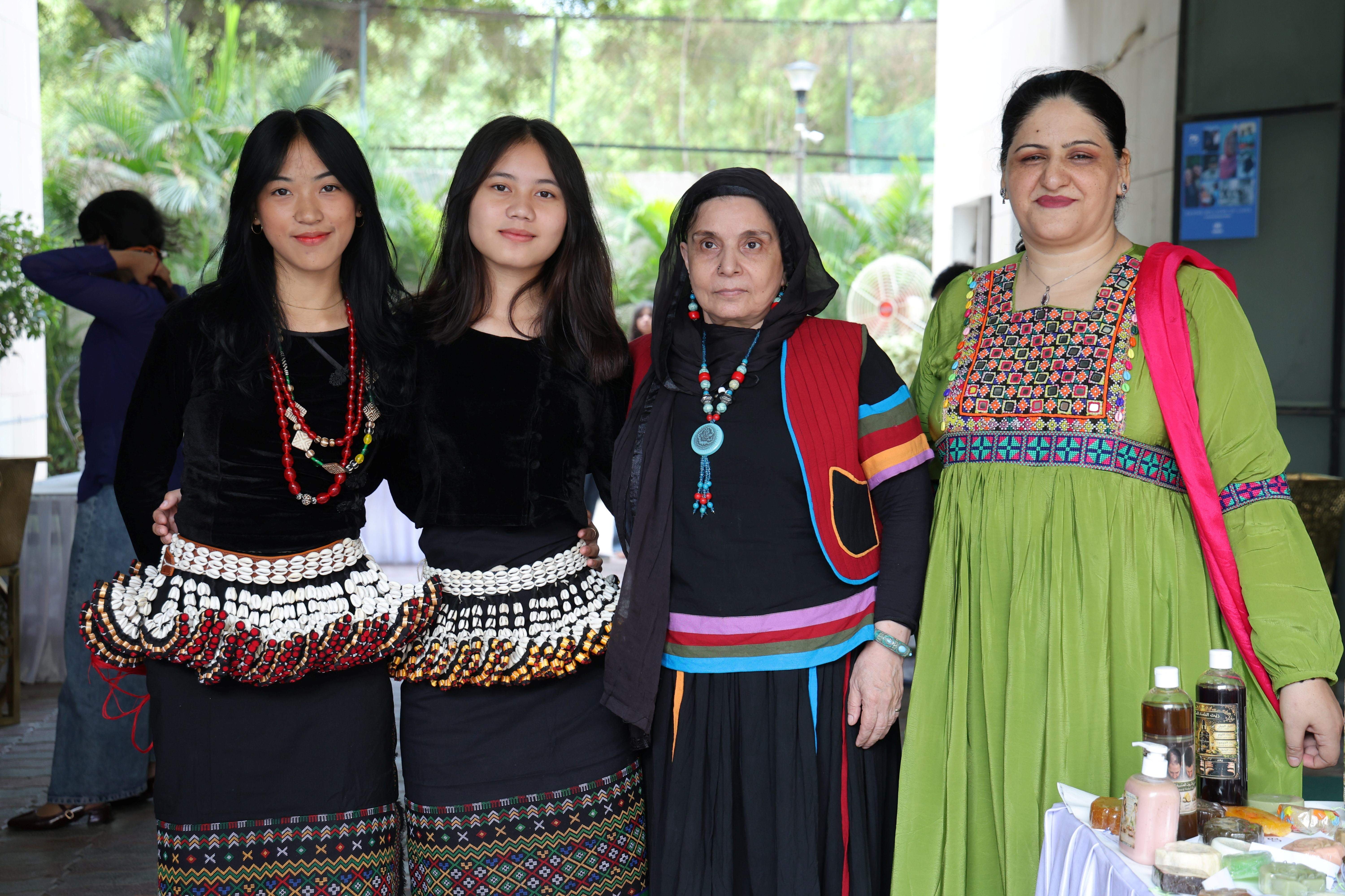 Community members proudly showcase traditional attire and cultural heritage during the World Refugee Day celebration, reflecting the diversity and richness of refugee communities in India.