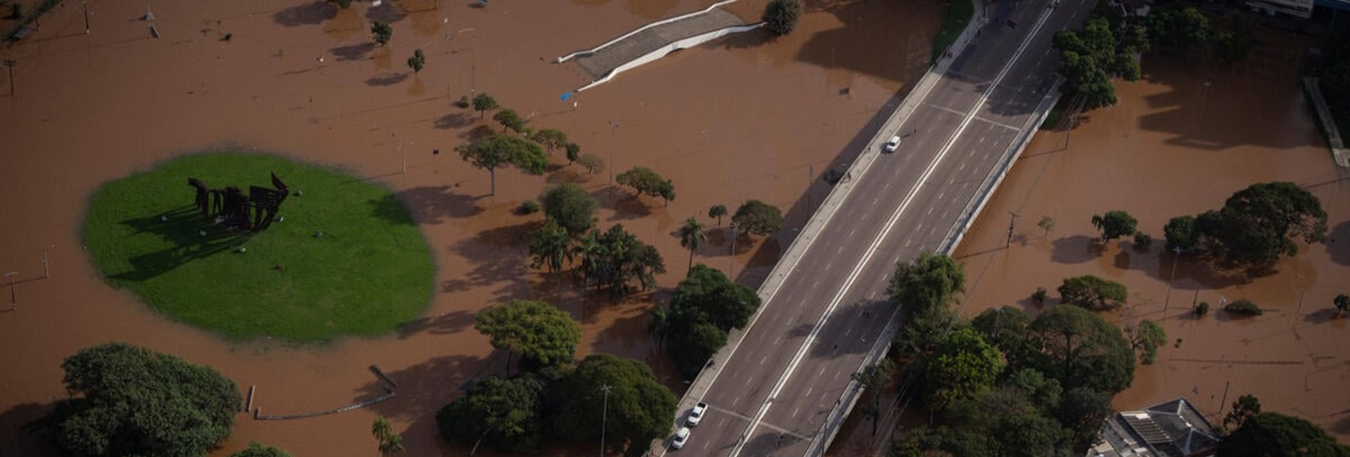 Aerial view of a flooded road bridge and park