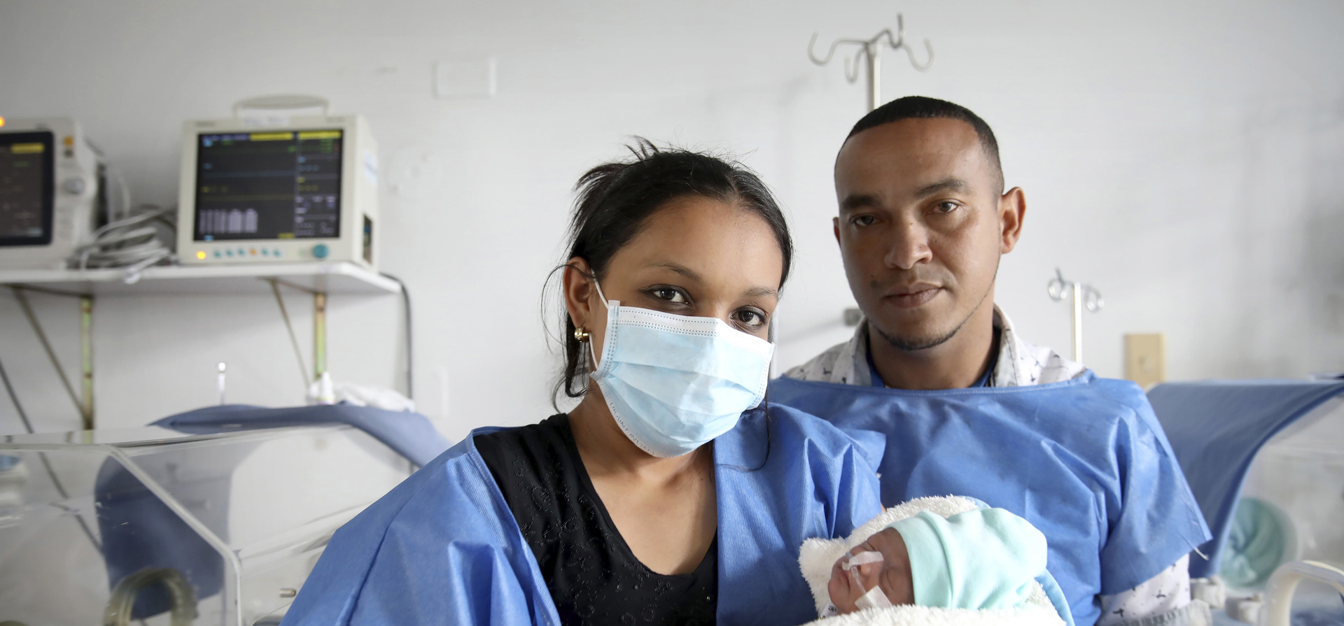 Parents Yonielys Villegas and José Miguel Sequera Borges visit their newborn son Enmanuel at the main maternity hospital in Bogota, Colombia.