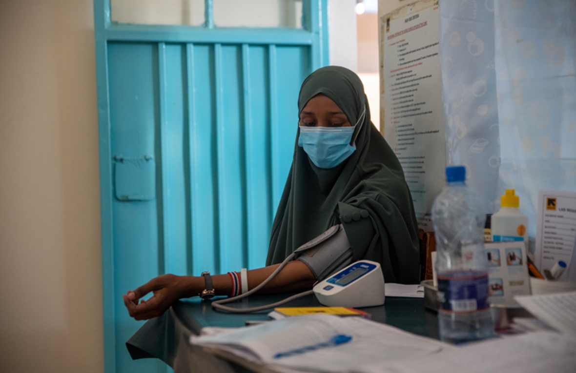 A woman has her blood pressure taken in a health clinic
