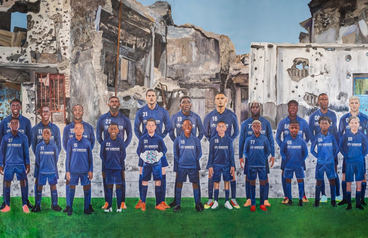 A painting showing a line-up of football players with their younger selves standing in front of them, with war-damaged buildings in the background