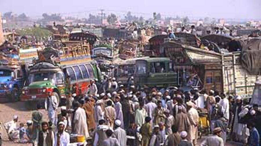 Afghans prepare to return home at the Takhta Baig registration centre near Peshawar.