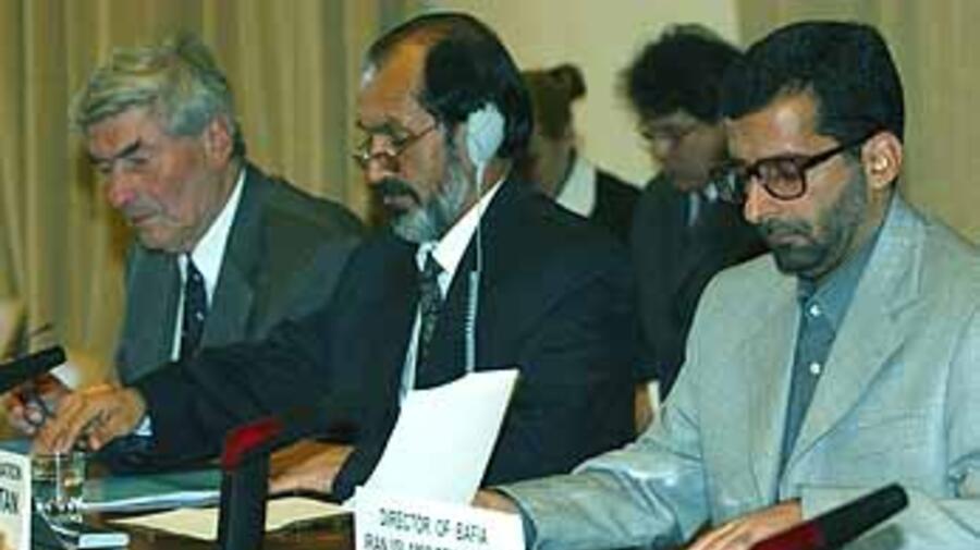 The UN High Commissioner for Refugees, the Afghan Interim Authority's Minister for Repatriation and the Director of the Islamic Republic of Iran's Bureau for Aliens and Foreign Immigration Affairs at the April 3 signing.