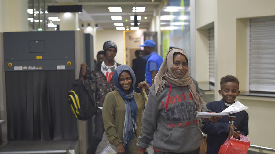 Refugees arrive in Kigalii, Rwanda after an evacuation flight form Libya