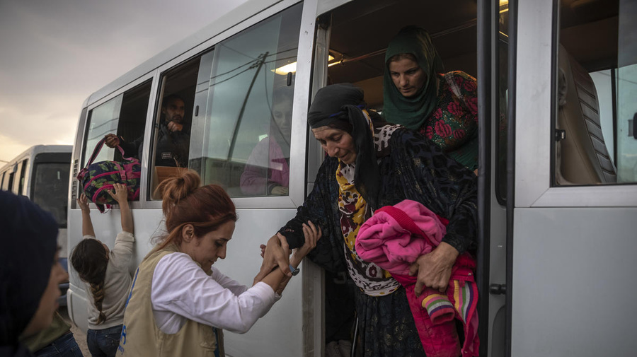 Iraq. Syrian refugees fleeing military campaign receive aid at UNHCR camp