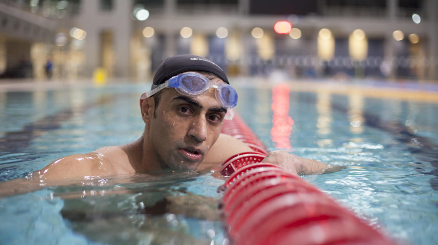 Greece. Syrian refugee carries the Olympic flame in Athens