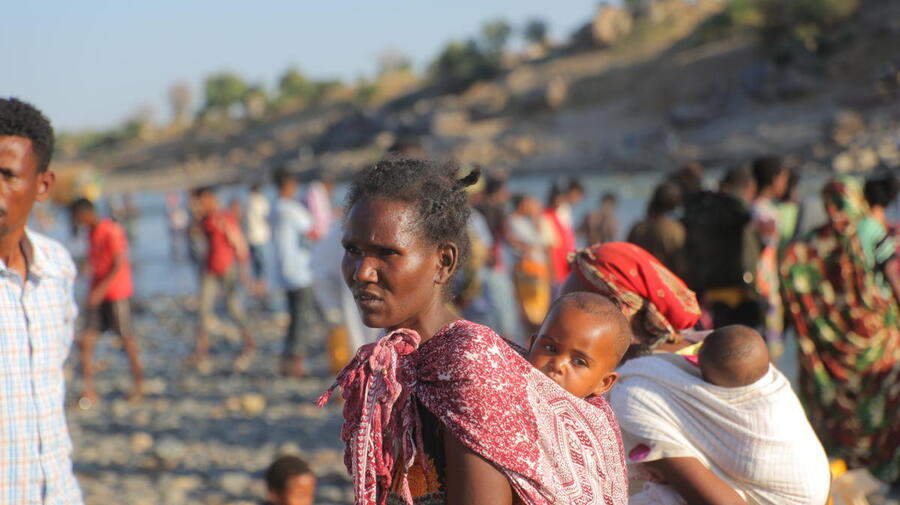 Ethiopian refugees fleeing clashes in the Tigray region, cross the border into Hamdayet, Sudan.