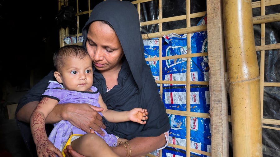 Bangladesh. Rohingya woman took shelter in her relative's home after losing everything in a recent fire at Kutupalong refugee settlement.