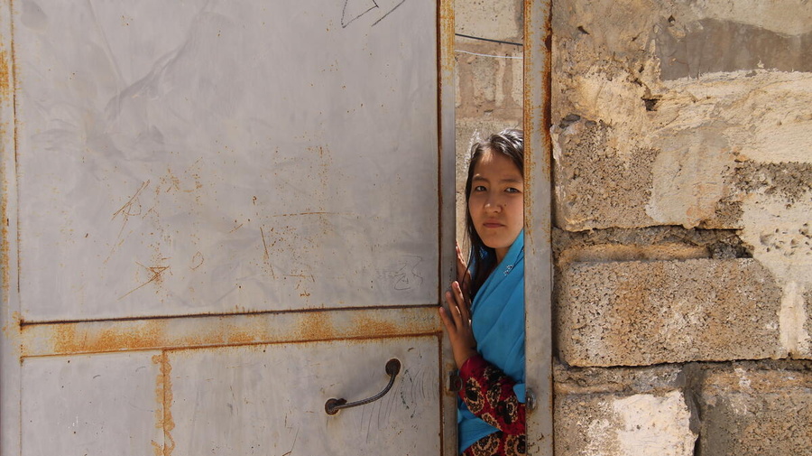 Iran. Refugee girl in Sarvestan Settlement in Shiraz