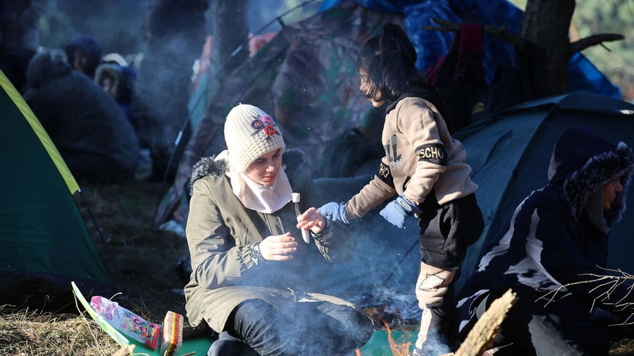 Refugees and migrants people gather on the Belarusian-Polish border