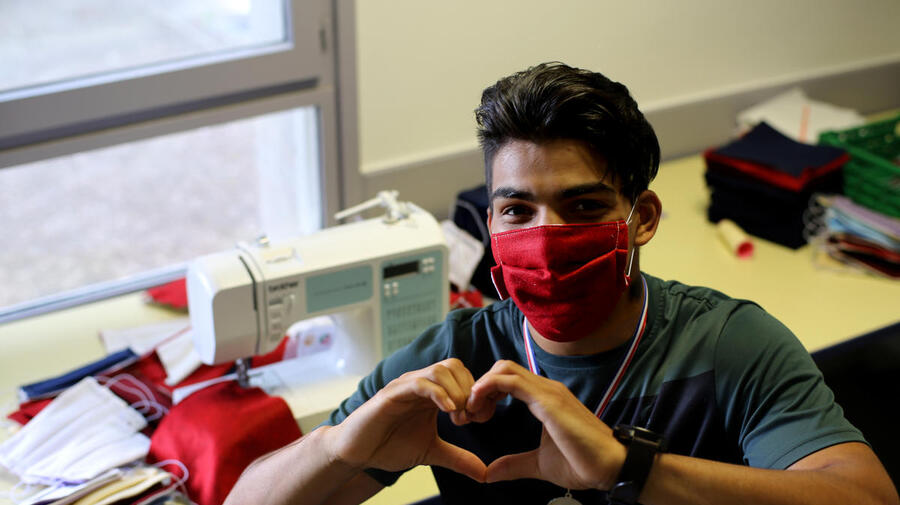 France. Young Afghan makes hundreds of masks to protect village from COVID-19