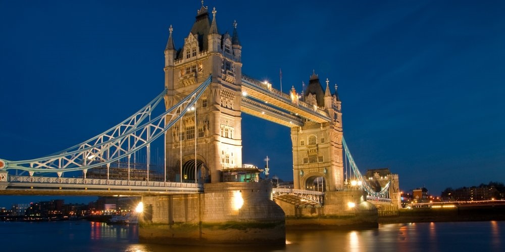 Photo of the Tower Bridge in London, UK. at night.