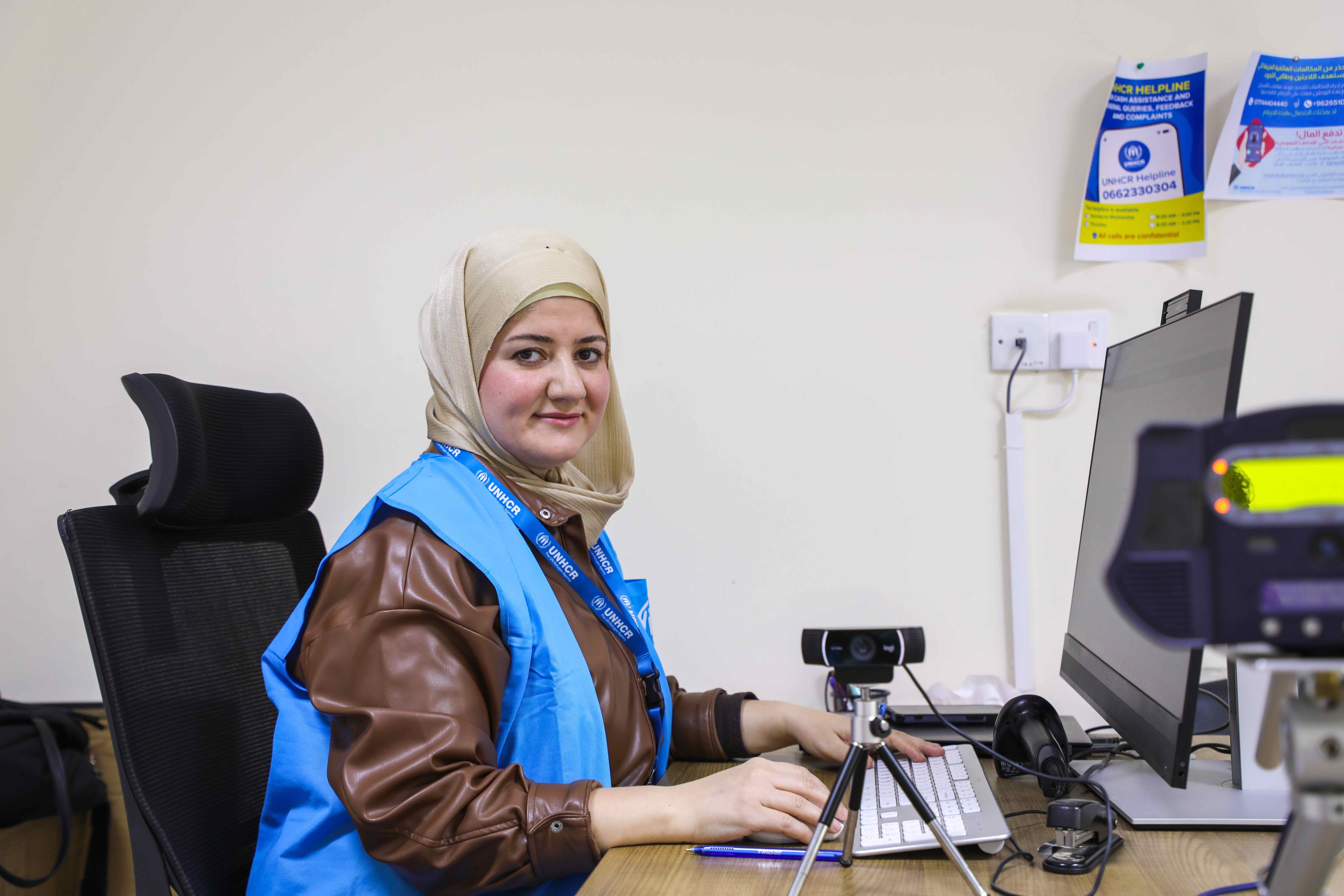 Saya sits at her desk at the UNHCR Registration Centre in Baherka. &copy; UNHCR/Lilly Carlisle