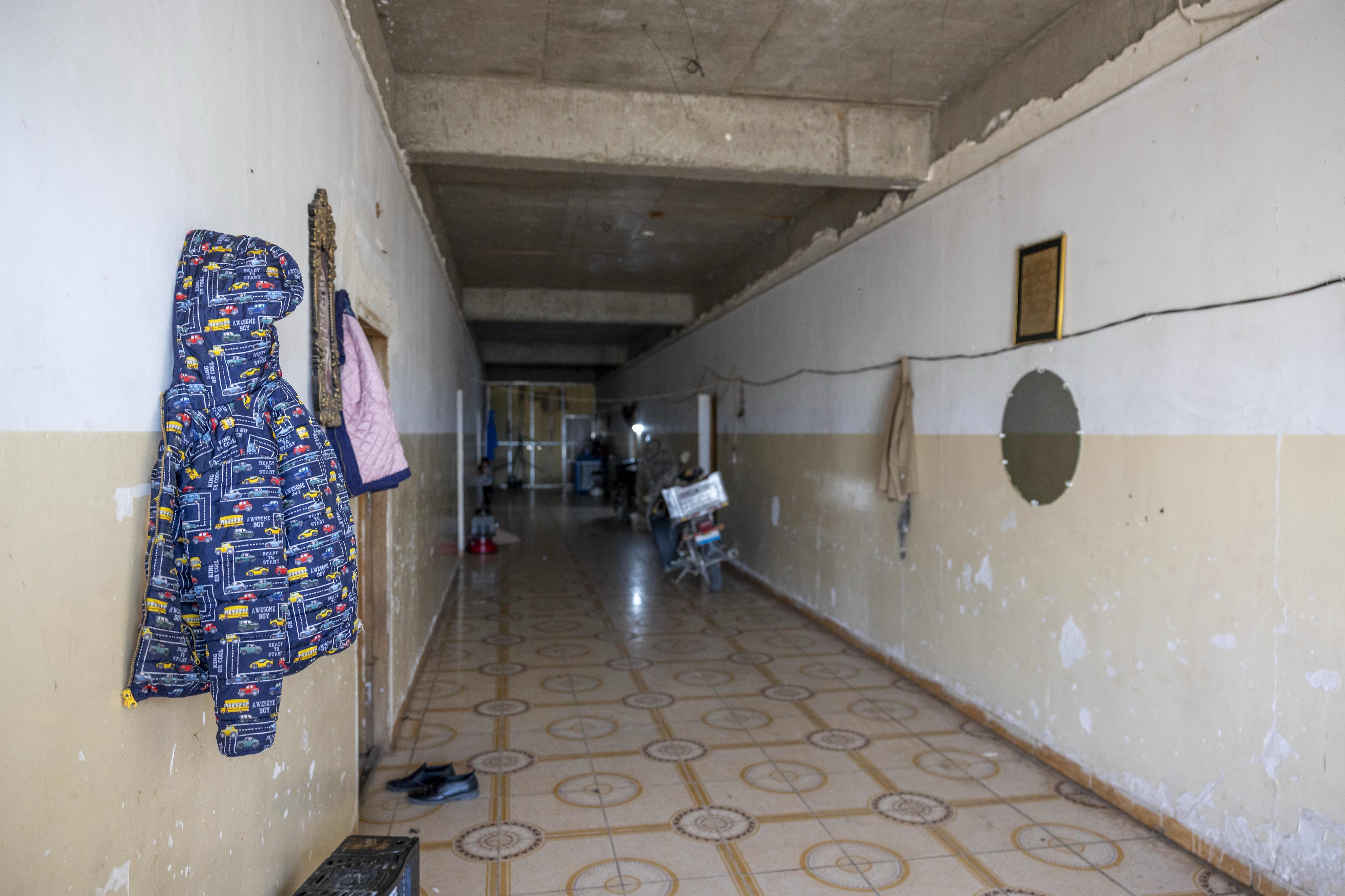 The corridors of an unfinished school building where Jasim and other vulnerable refugee families live.