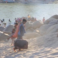 Ethiopian refugees, fleeing clashes in the country's northern Tigray region, cross the border into Hamdayet, Sudan, over the Tekeze river.
