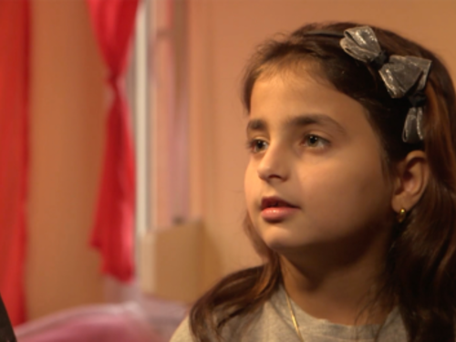 A young child looking to the side