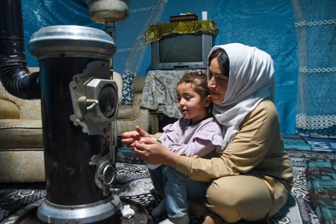 Lebanon. Khadija Ayman Tamer, mother of 3 (2 girls, 1 boy) living in an informal settlement with her husband and children and their cat