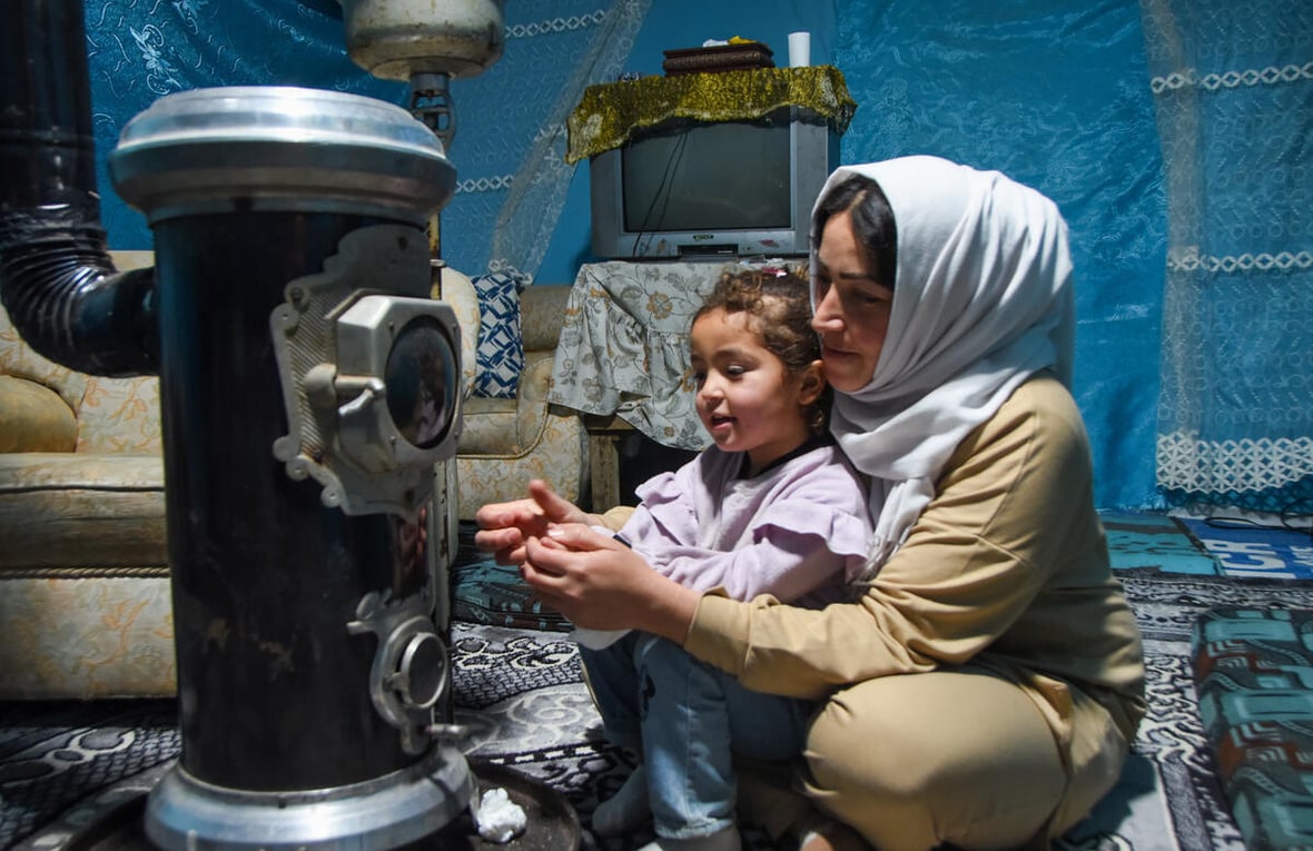 Lebanon. Khadija Ayman Tamer, mother of 3 (2 girls, 1 boy) living in an informal settlement with her husband and children and their cat