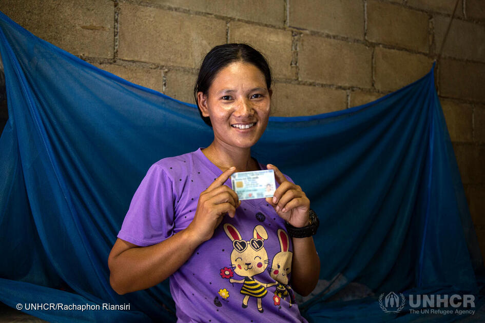 Thailand, Chiang Mai. Meepia Chumee, formerly stateless, shows off her new Thai ID.
