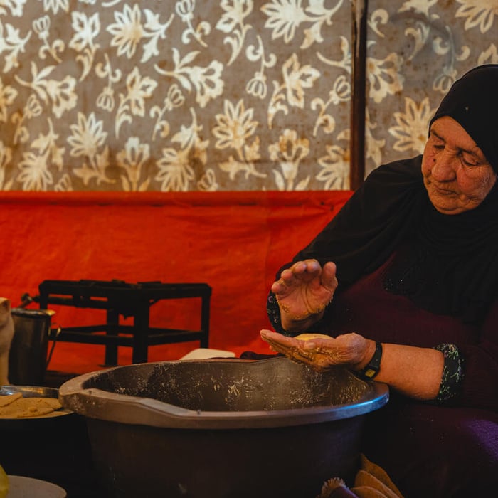 Jordan. Sabah with family inside their substandard shelter in Amman suburb