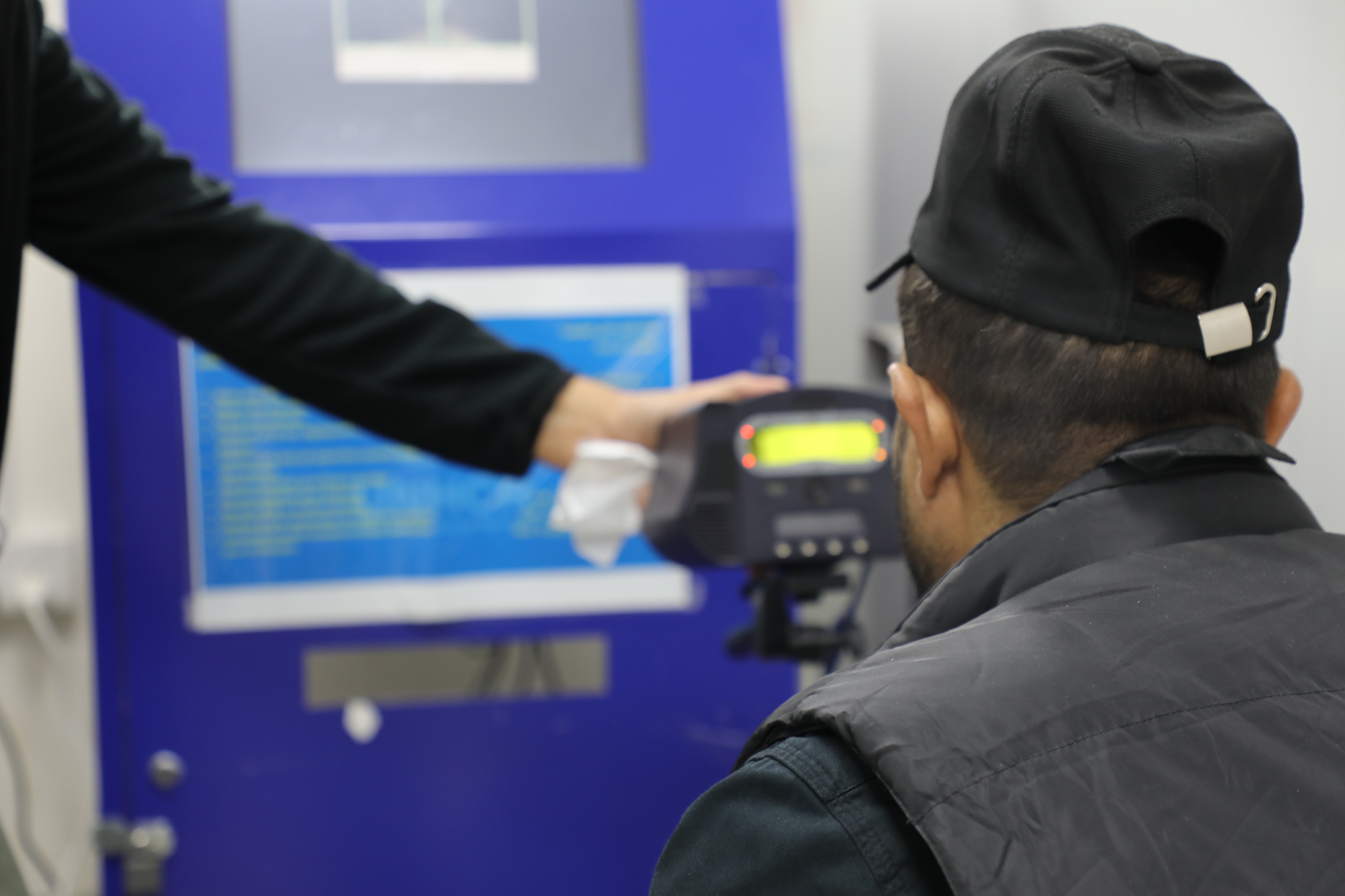 Syrian Refugee Using Kiosk at UNHCR Registration Centre in Amman, Jordan