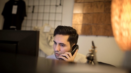 Omid Sharif, from Afghanistan, works at the reception of the hotel1.jpg Omid Sharif, from Afghanistan, works at the reception of the hotel1.jpg