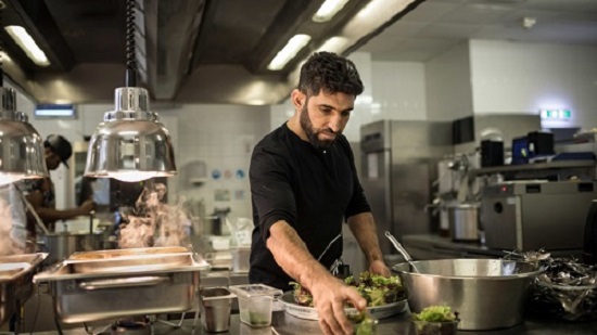 Sherahmad Razi, 32, from Afghanistan, helps out in the kitchen4.jpg Sherahmad Razi, 32, from Afghanistan, helps out in the kitchen4.jpg