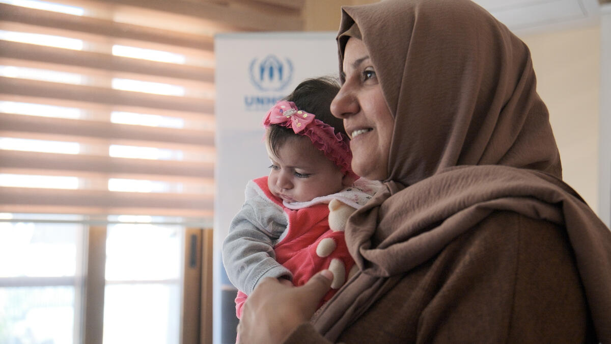 Turkiye. Syrian earthquake survivor Ghofran Aus with her daughter.