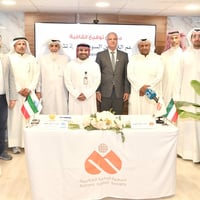 A group photo following the signing of the agreement between AlRahma International and UNHCR, represented by Mr. Hesham Al-Oumi, Chairman of the Board of AlRahma International, and Dr. Khaled Khalifa, UNHCR Representative to the Gulf Cooperation Council countries.