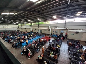 Refugees gathered in the main waiting area of the UNHCR reception centre in Beirut, Lebanon. 