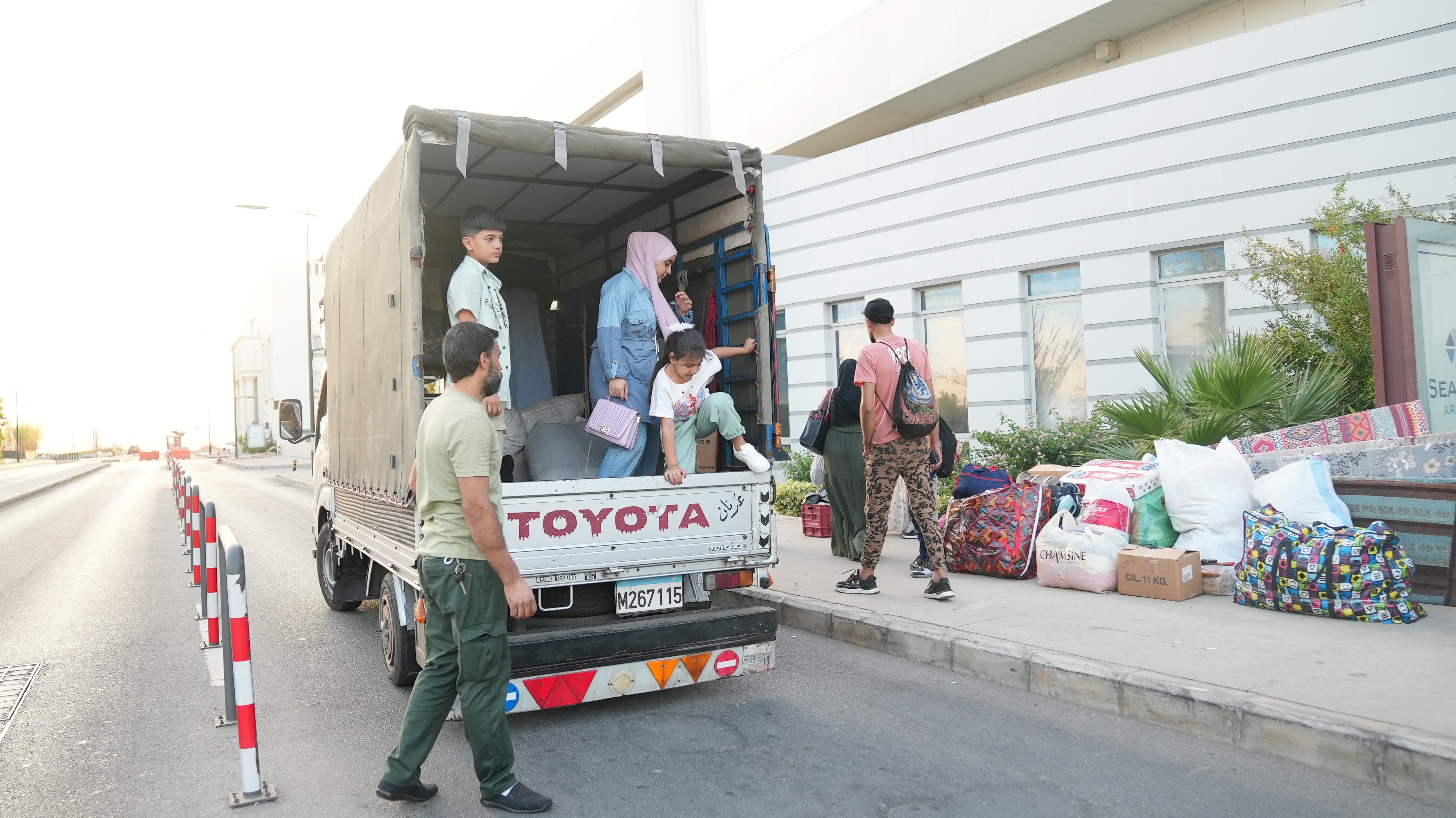 A truck being loaded with Syrian refugees' stuff before returning to Syria after years of displacement. 