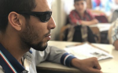 With resolve and a cell phone, blind refugee resumes school
