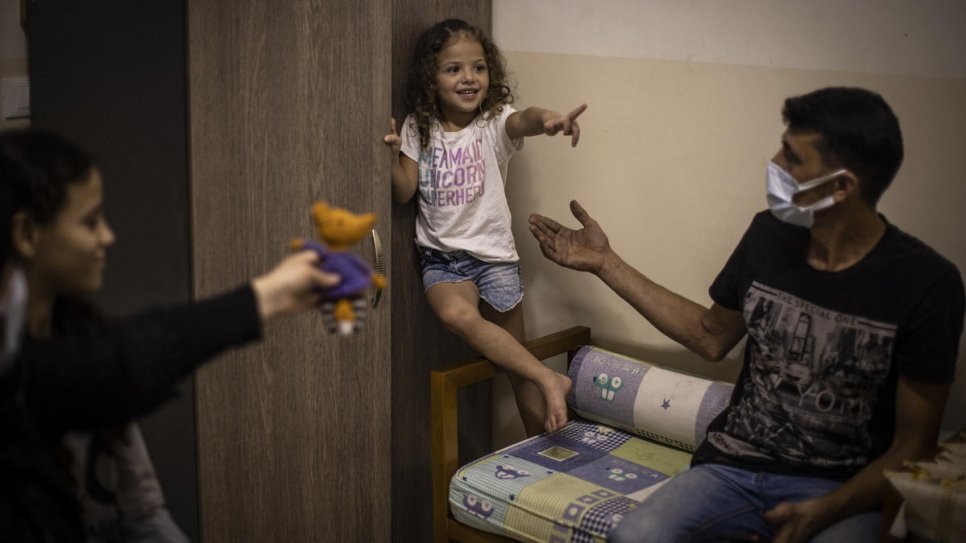 Manar plays with her father Mohammad at their home in Beirut, Lebanon. © UNHCR/Diego Ibarra Sánchez