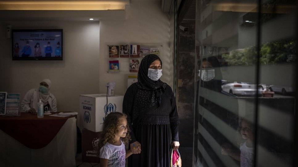 Manar and her mother Fahima leave the Makhzoumi Foundation clinic in Beirut after a psychological support session. © UNHCR/Diego Ibarra Sánchez