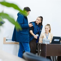 Three operators discuss at the Cash Enrolment Centre of Causeni, Moldova