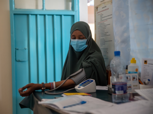 A woman has her blood pressure taken in a health clinic