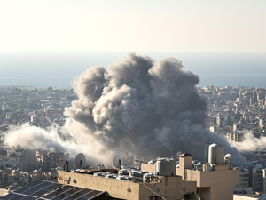 A cloud of smoke caused by the impact of a missile strike is visible over the Haret Hreik neighbourhood of Beirut, Lebanon.
