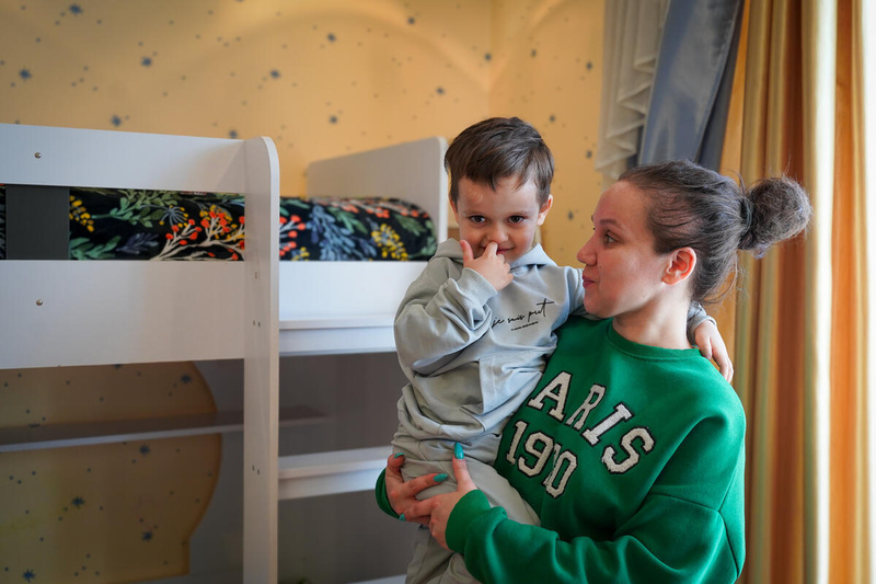 Woman carrying a child