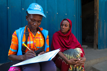 UNHCR Officer interacting with a refugee